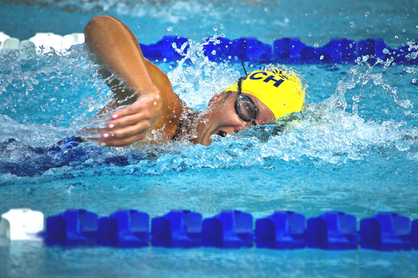 Woman swimming laps in the pool