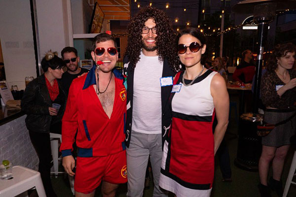 Young adults dress up in costumes for a fun social event