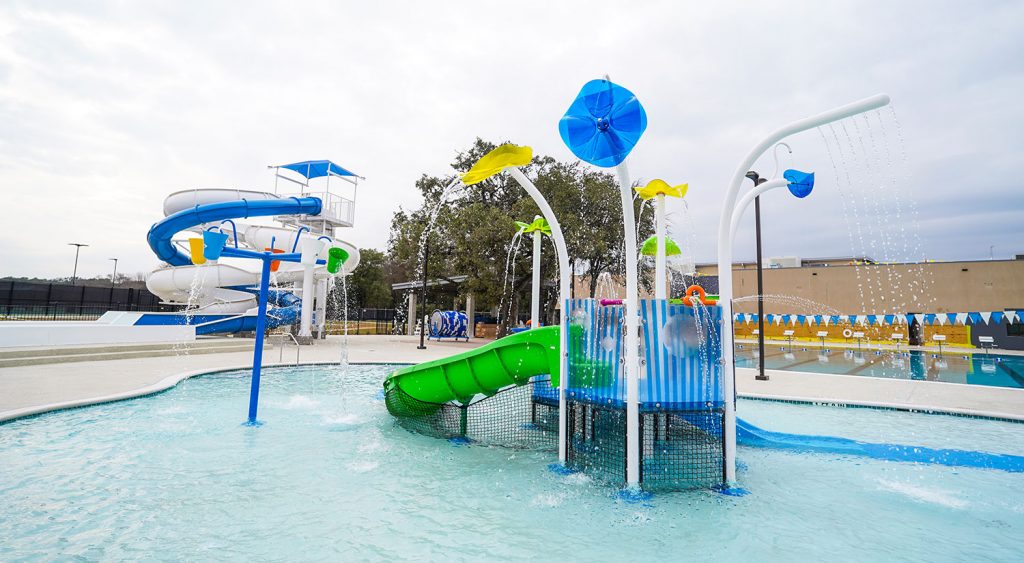 The new children’s activity pool includes spray features, dumping buckets, water tables and slides. Kids of all ages can enjoy an additional feature of two large slides. Credit: Dave Hawks
