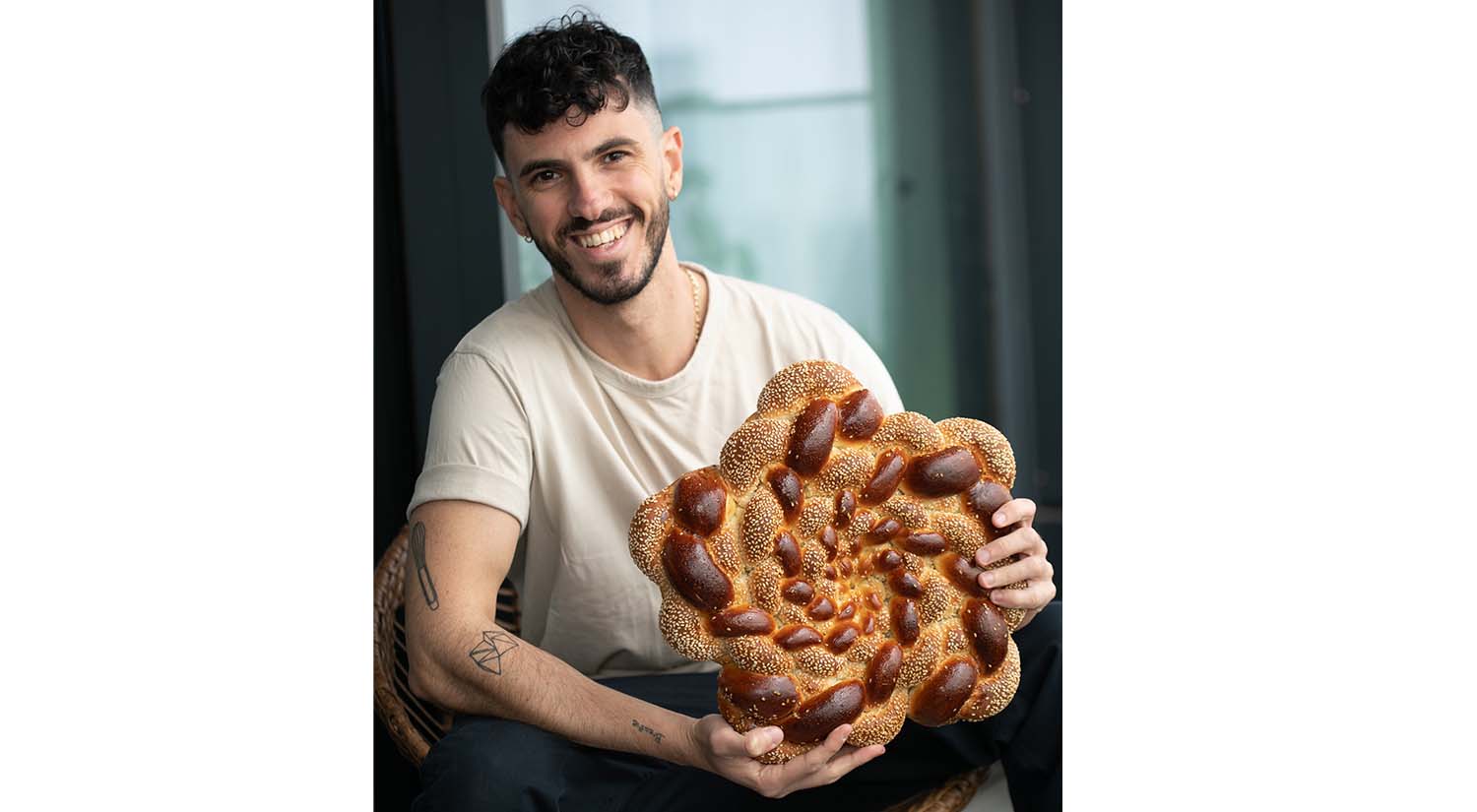 Challah Prince with a loaf of challah