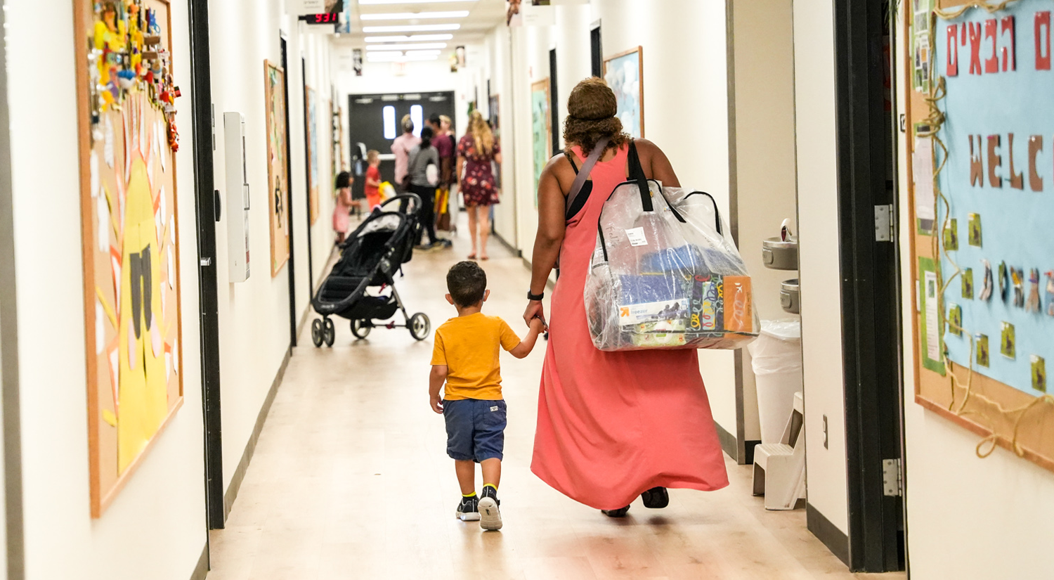 adult and child walking halls at ECP