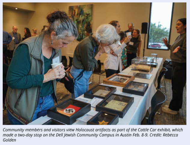 Community members and visitors view Holocaust artifacts as part of the Cattle Car exhibit, which made a two-day stop on the Dell Jewish Community Campus in Austin Feb. 8-9. Credit: Rebecca Golden