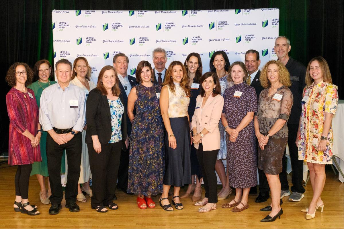 Event Co-chairs and Jewish National Fund-USA Austin Board with Keynote Speaker Avi Melamed (back row, middle) Keynote Speech: Avi Melamed delivers his keynote address Guest Group: Janice Pierce, Candy Goldstein, Arlene Maze, Lawrence Maze, David Goldstein. Credit: Andrew Holmes