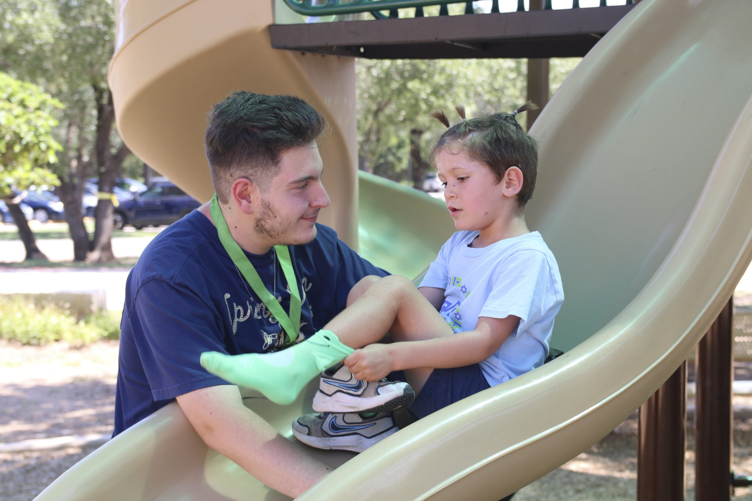 camp counselor and kid slide